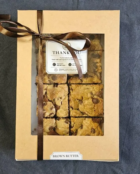 A kraft gift box of Brown Butter Brookies tied with a ribbon