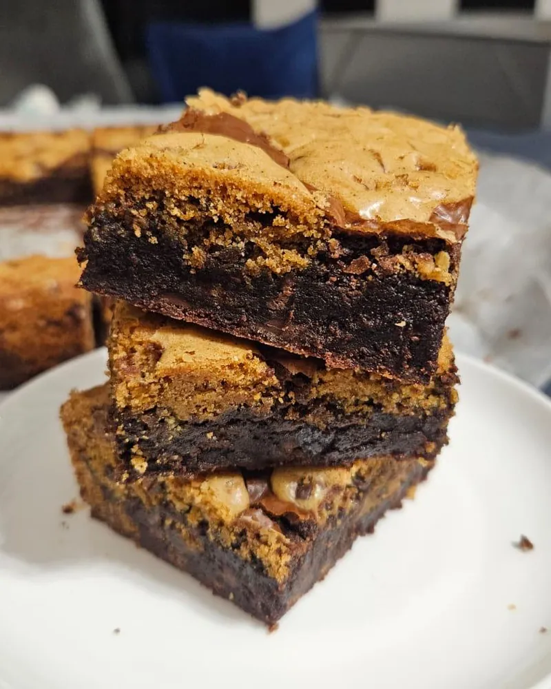 Three Brown Butter Brookies stacked on a plate