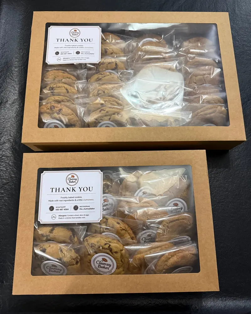 Two kraft gift boxes of cookies with thank-you cards
